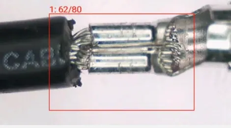 NG1 sample showing cable misalignment during riveting